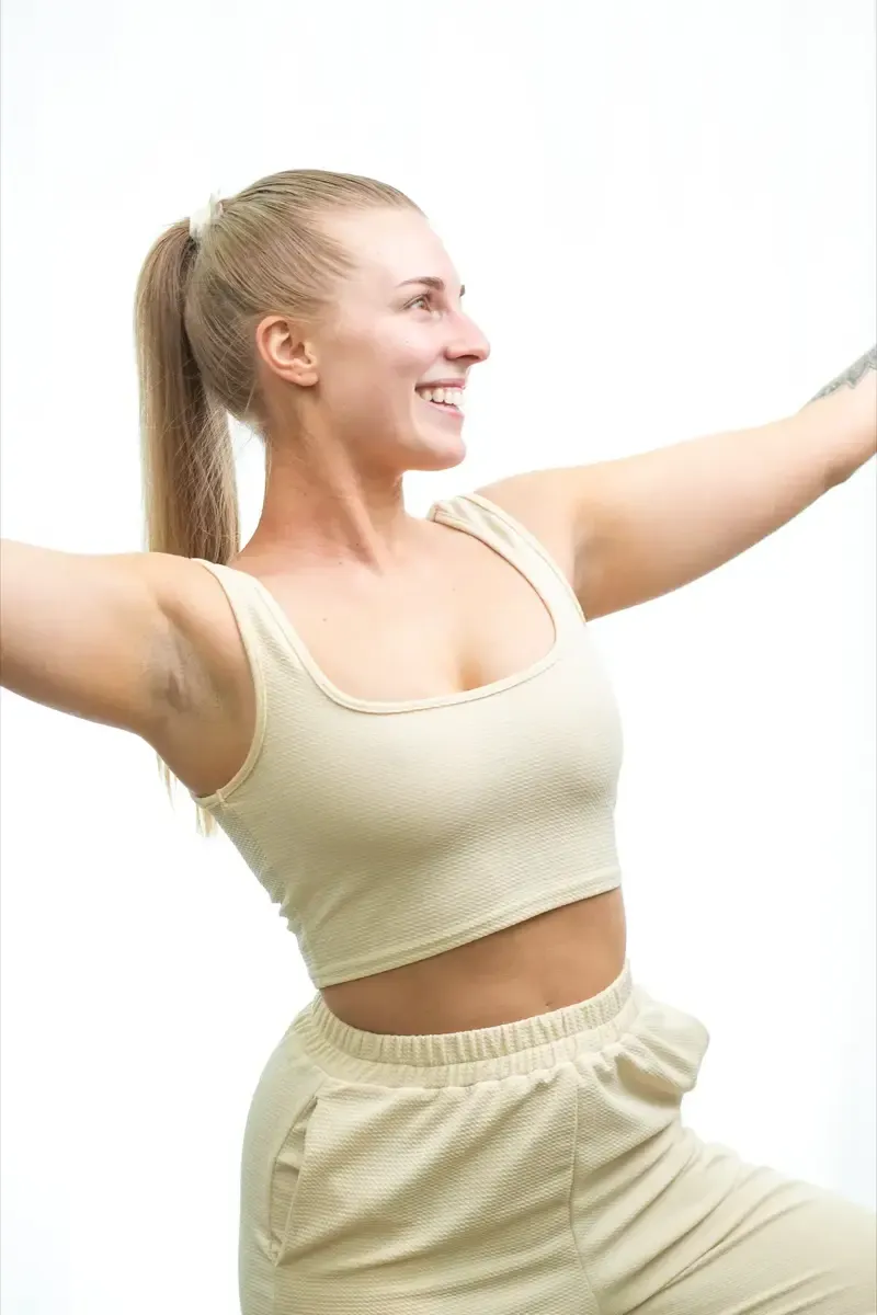 Lifestyle brand photography of woman in natural yoga outfit for Simple Body