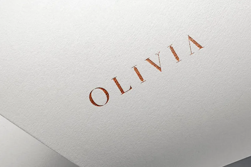 Olivia Boutique logo foil-stamped in copper on white cotton paper