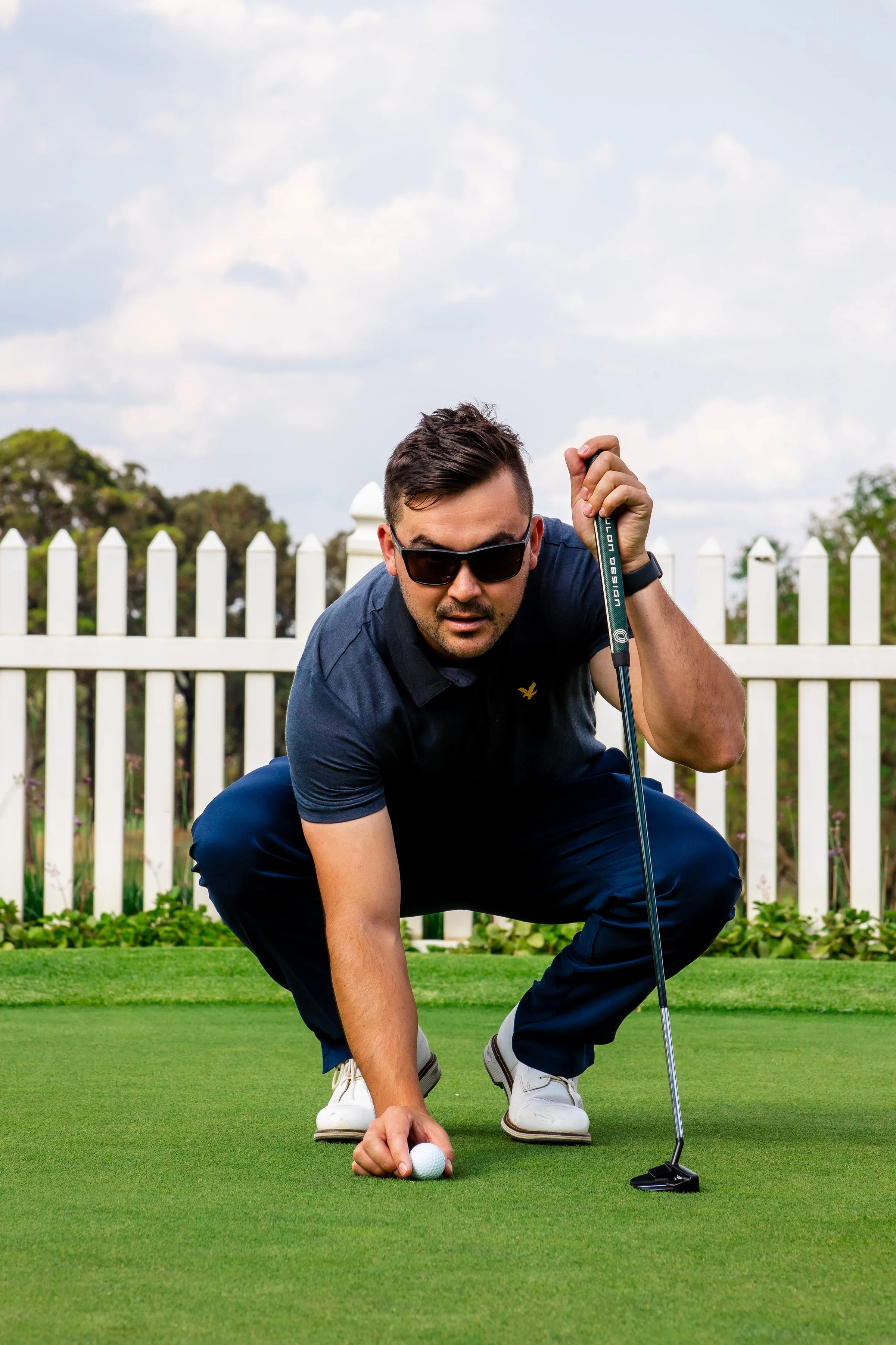 Model wearing JondoSport sunglasses on the golf course during a lifestyle photo session
