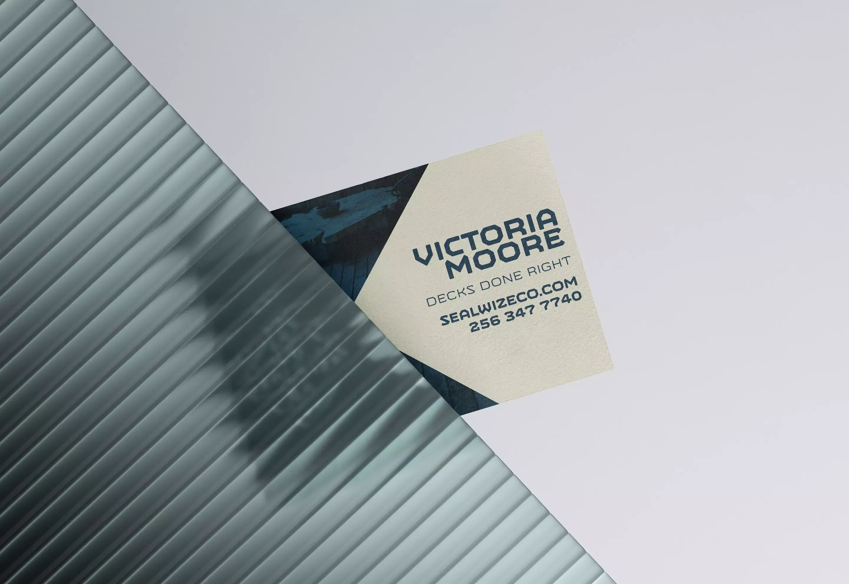 Sealwise business card mockup showing the diamond-cut design with navy and cream colorway
