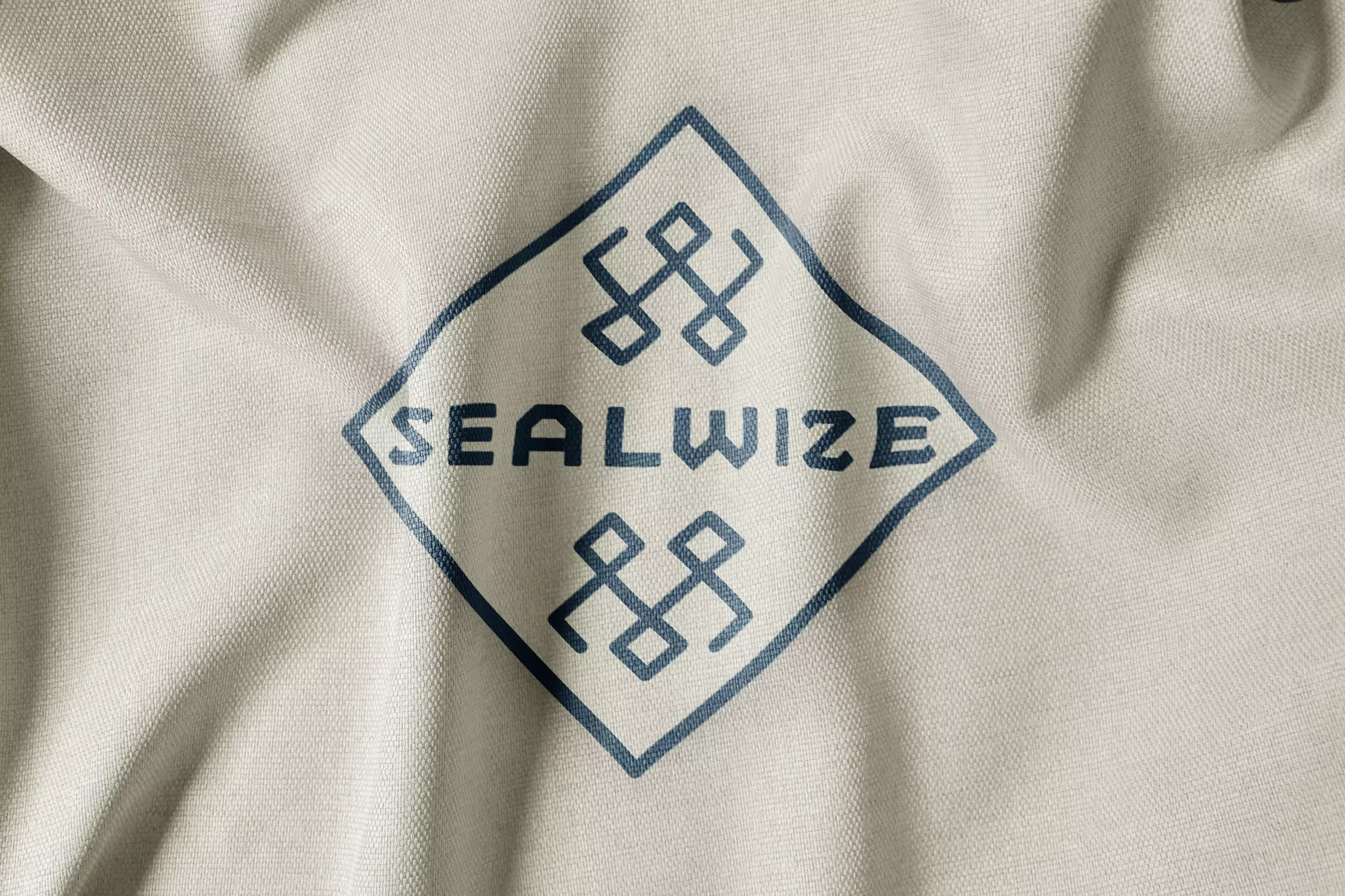 Sealwise brand flag mockup showing the geometric diamond logo on fabric